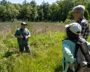 An expert evaluates wetlands and educates Rauscher Farm volunteers